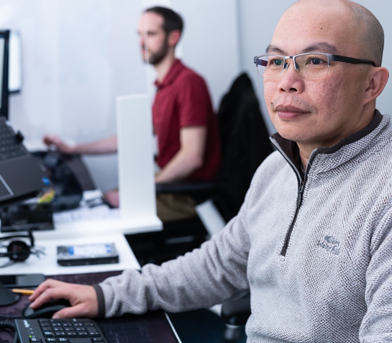 IT engineers resolve an issue with a client's system